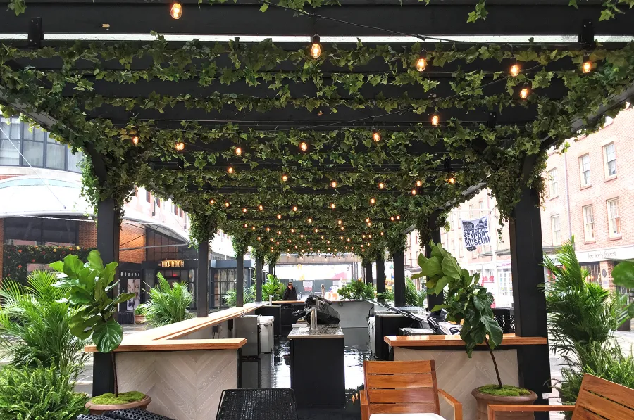 Custom Wooden Pergola (Options: 82' L x 16' W, Douglas-fir, Open Roof with Rafters at 18", with Transparent Rain Guard, 12-Post Anchor Kit, No Ceiling Fan Base, 12' Post Height, Custom Black Paint). This pergola is part of the giant popup beer hall at the Southside Seaport in downtown Manhattan from May to Oct 2017: https://www.timeout.com/newyork/blog/a-giant-pop-up-beer-hall-is-opening-at-south-street-seaport-this-summer-032417