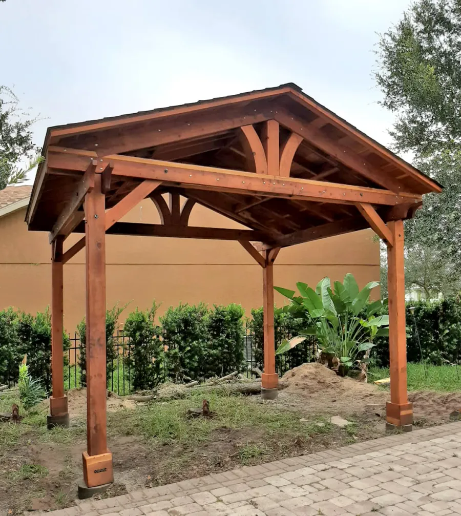 Del Norte Outdoor Kitchen Pavilion (Options: 12' L x 14' W, California Redwood, 4-Post Anchor Kit for High-Wind, 1 Ceiling Fan Base, 1 Electrical Wiring Trim Kit, No Post Decorative Trims, Transparent Premium Sealant). Photo Courtesy of Ion Tiu of Windermere, Florida.