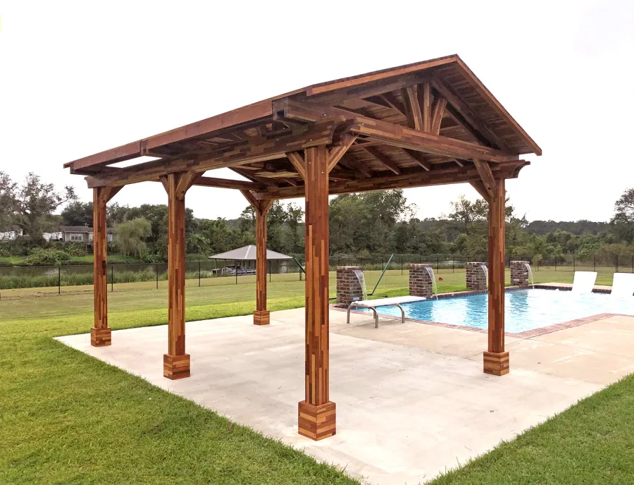 Del Norte Outdoor Kitchen Pavilion (Options: 18' L x 12' W, Mosaic Redwood, 4-Post Anchor Kit for Concrete, 1 Ceiling Fan Base, 2 Electrical Wiring Trim Kits, No Post Decorative Trims, Transparent Premium Sealant). With 5 Posts by Custom Request. Photo Courtesy of A. Bamburg of Natchitoches, Louisiana.