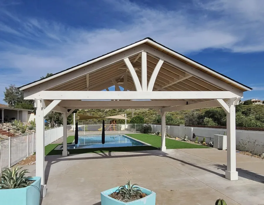 Del Norte Outdoor Kitchen Pavilion (Options: 22' L x 22' W, Douglas-fir, No Privacy Panel, 4-Post Anchor Kit for High-Wind, 10' H Posts, 2 Ceiling Fan Bases, 1 Curtain Rod, No Fascia Boards, Electrical Wiring Trim Kit for 2 Posts, T&G Boards in Sugar Pine with Transparent Premium Sealant by Custom Request, Off-White Oil Based Primer). Photo Courtesy of C. Hypes of Tucson, AZ.