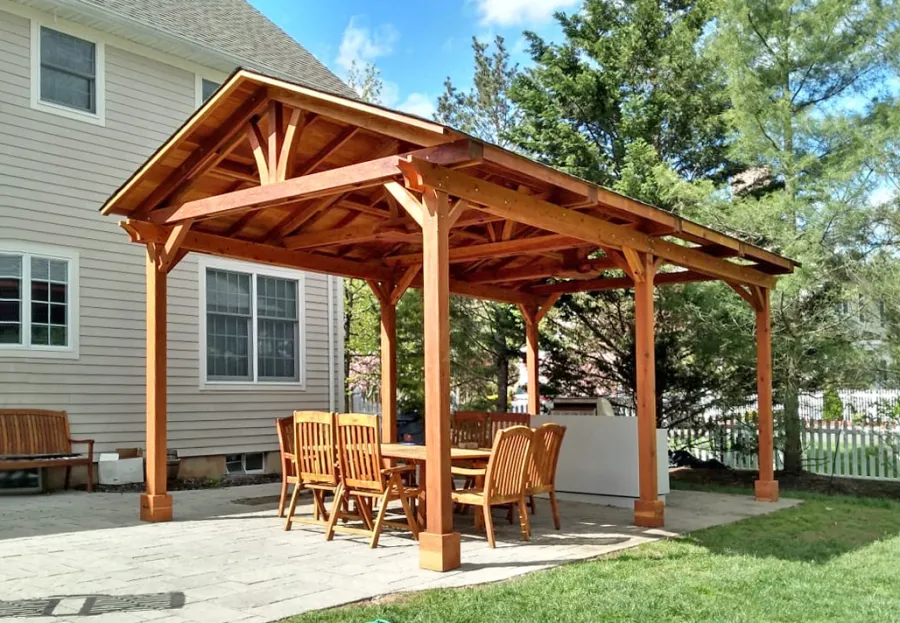 Del Norte Outdoor Kitchen Pavilion (Options: 25' L x 14' W, California Redwood, 6-Post Anchor Kit for High-Wind, 2 Ceiling Fan Bases, No Electrical Wiring Trim Kit, No Post Decorative Trim, Transparent Premium Sealant). Photo Courtesy of D. Meekings of Scotch Plains, New Jersey.