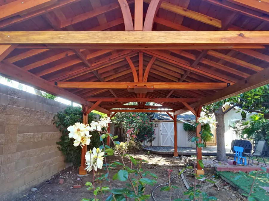 Del Norte Outdoor Kitchen Pavilion (Options: 35' L x 15' W, California Redwood, 6-Post Anchor Kit for High-Wind, 2 Ceiling Fan Bases, 2 Electrical Wiring Trim Kits, No Post Decorative Trims, Transparent Premium Sealant). Photo Courtesy of D. Loyola of San Jose, California.