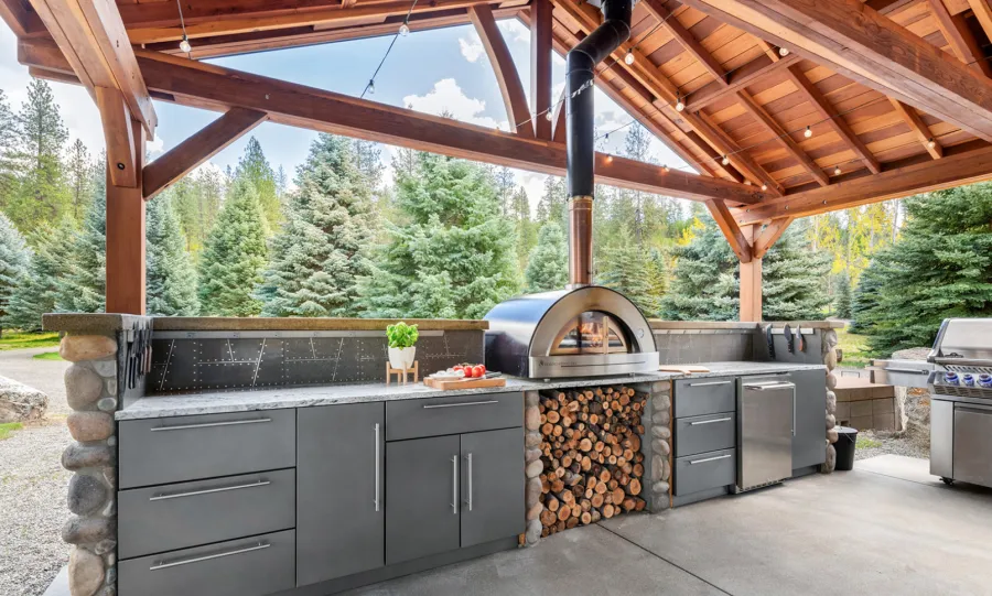Del Norte Outdoor Kitchen Pavilion (Options: 38.5' L x 18.5' W, California Redwood, No Privacy Panel, Post Anchor Kit for High Wind, 10' H Posts, No Ceiling Fan Base, No Curtain Rod, No Fascia Boards, Transparent Premium Sealant). Photo Courtesy of D. Lemke of Nine Mile Falls, NJ. 