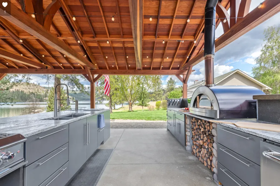Del Norte Outdoor Kitchen Pavilion (Options: 38.5' L x 18.5' W, California Redwood, No Privacy Panel, Post Anchor Kit for High Wind, 10' H Posts, No Ceiling Fan Base, No Curtain Rod, No Fascia Boards, Transparent Premium Sealant). Photo Courtesy of D. Lemke of Nine Mile Falls, NJ. 