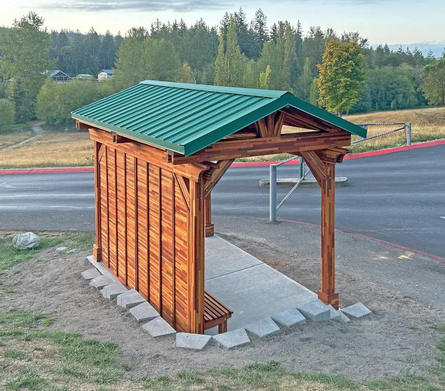 Custom Del Norte Pavilion - Bus Shelter (Options: 14' L x 10' W, Mosaic Redwood, 1 Wall Privacy Panel, Post Anchor Kit for High Wind, 9' H Posts, No Ceiling Fan Base, No Electrical Wiring Trims, No Curtain Rod, Transparent Premium Sealant). Structure Installed at Sehmel Homestead Park in 10123 78th Ave NW, Gig Harbor, WA 98332. , 
