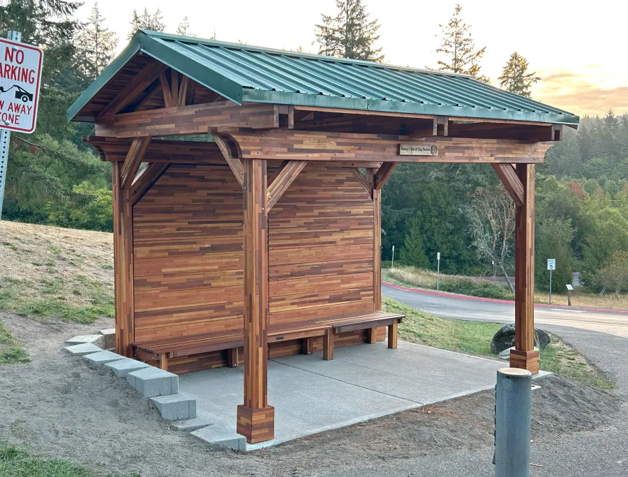 Custom Del Norte Pavilion - Bus Shelter (Options: 14' L x 10' W, Mosaic Redwood, 1 Wall Privacy Panel, Post Anchor Kit for High Wind, 9' H Posts, No Ceiling Fan Base, No Electrical Wiring Trims, No Curtain Rod, Transparent Premium Sealant). Structure Installed at Sehmel Homestead Park in 10123 78th Ave NW, Gig Harbor, WA 98332. , 