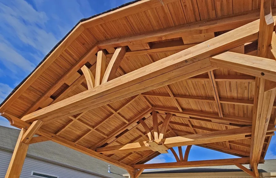 Del Norte Outdoor Kitchen Pavilion (Options: 13' L x 20' W, Mosaic Douglas-fir, No Privacy Panel, 4-Post Anchor Kit for Concrete, 11.5' H Posts, 1 Ceiling Fan Base, No Curtain Rod, No Fascia Boards, Transparent Premium Sealant). Photo Courtesy of H. Hinnant of Piedmont, SC.