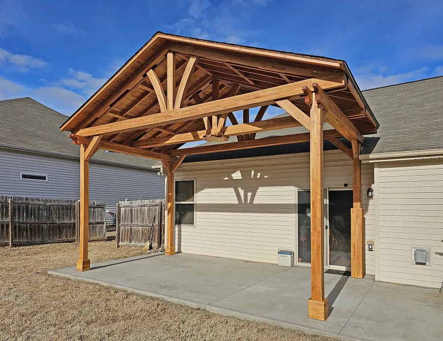 Del Norte Outdoor Kitchen Pavilion (Options: 13' L x 20' W, Mosaic Douglas-fir, No Privacy Panel, 4-Post Anchor Kit for Concrete, 11.5' H Posts, 1 Ceiling Fan Base, No Curtain Rod, No Fascia Boards, Transparent Premium Sealant). Photo Courtesy of H. Hinnant of Piedmont, SC.