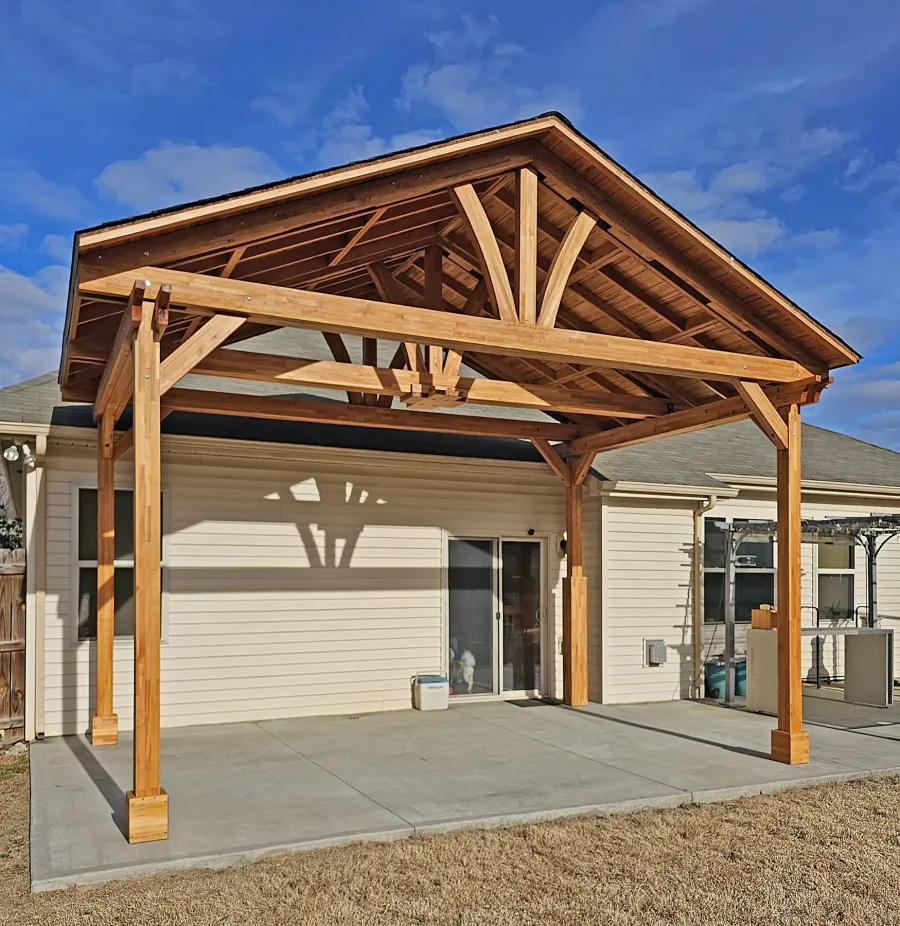 Del Norte Outdoor Kitchen Pavilion (Options: 13' L x 20' W, Mosaic Douglas-fir, No Privacy Panel, 4-Post Anchor Kit for Concrete, 11.5' H Posts, 1 Ceiling Fan Base, No Curtain Rod, No Fascia Boards, Transparent Premium Sealant). Photo Courtesy of H. Hinnant of Piedmont, SC.