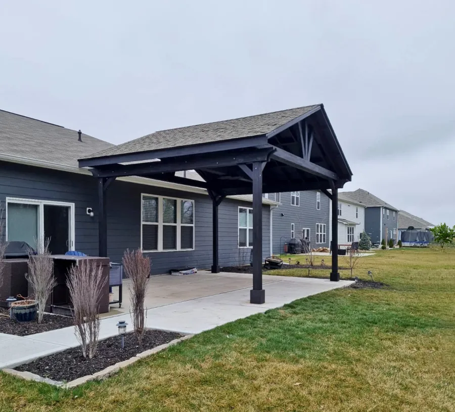 Del Norte Outdoor Kitchen Pavilion (Options: 16' L x 20' W, Mosaic Redwood, No Privacy Panel, 4-Post Anchor Kit for Concrete, 11' H Posts, 1 Ceiling Fan Base, No Curtain Rod, Black Stain Premium Sealant). Photo Courtesy of J. Miller of Brownsburg, Indiana.
