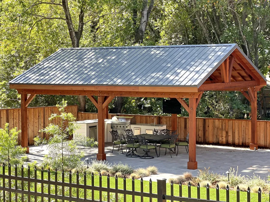 Custom Del Norte Outdoor Kitchen Pavilion (Options: 28' L x 22' W, Mature Redwood, No Privacy Panel, Post Anchor Kit for High Wind, 10.5' H Posts, 8x8 Posts, 2 Ceiling Fan Bases, 1 T.V. Mount Base, 2 Electrical Wiring Trims, No Curtain Rod, Transparent Premium Sealant). Photo Courtesy of J. Quinlan of Novato, CA.