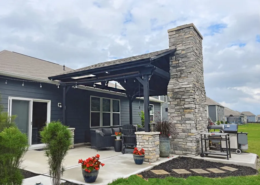 Del Norte Outdoor Kitchen Pavilion (Options: 16' L x 20' W, Mosaic Redwood, No Privacy Panel, 4-Post Anchor Kit for Concrete, 11' H Posts, 1 Ceiling Fan Base, No Curtain Rod, Black Stain Premium Sealant). Photo Courtesy of J. Miller of Brownsburg, Indiana.
