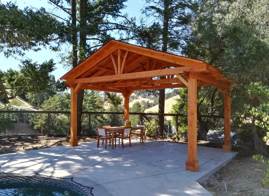 Del Norte Outdoor Kitchen Pavilion (Options: 14' L x 20' W, Douglas-fir, 4-Post Anchor Kit for High-Wind, 1 Ceiling Fan Base, 1 Electrical Wiring Trim Kit, No Post Decorative Trims, Transparent Premium Sealant). Photo Courtesy of R. Jones of Walnut Creek, California.