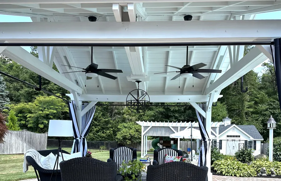 Del Norte Outdoor Kitchen Pavilion (Options: 15' L x 18' W, Mosaic Douglas-Fir, 4-Post Anchor Kit for Concrete, 9.5' H Posts, 1 Ceiling Fan Base, 1 Electrical Wiring Trim Kit, 4 Curtain Rods, White Stain Premium Sealant). Photo Courtesy of S. Leonard of Easton, MA.