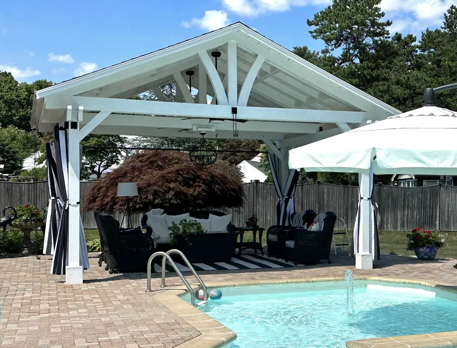 Del Norte Outdoor Kitchen Pavilion (Options: 15' L x 18' W, Mosaic Douglas-Fir, 4-Post Anchor Kit for Concrete, 9.5' H Posts, 1 Ceiling Fan Base, 1 Electrical Wiring Trim Kit, 4 Curtain Rods, White Stain Premium Sealant). Photo Courtesy of S. Leonard of Easton, MA.