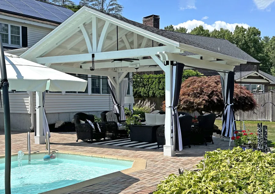 Del Norte Outdoor Kitchen Pavilion (Options: 15' L x 18' W, Mosaic Douglas-Fir, 4-Post Anchor Kit for Concrete, 9.5' H Posts, 1 Ceiling Fan Base, 1 Electrical Wiring Trim Kit, 4 Curtain Rods, White Stain Premium Sealant). Photo Courtesy of S. Leonard of Easton, MA.