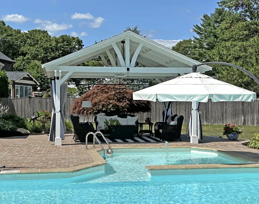 Del Norte Outdoor Kitchen Pavilion (Options: 15' L x 18' W, Mosaic Douglas-Fir, 4-Post Anchor Kit for Concrete, 9.5' H Posts, 1 Ceiling Fan Base, 1 Electrical Wiring Trim Kit, 4 Curtain Rods, White Stain Premium Sealant). Photo Courtesy of S. Leonard of Easton, MA.