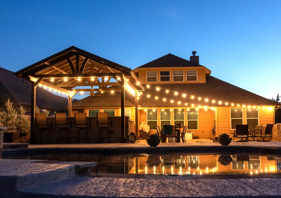 Del Norte Outdoor Kitchen Pavilion (Options: 20' L x 16' W, Mosaic Redwood, 4-Post Kit for Concrete, 1 Ceiling Fan Base, No Electrical Wiring Trim Kit, No Post Decorative Trims, Custom Sealant). Photo Courtesy of S. Oster of Round Rock, TX.