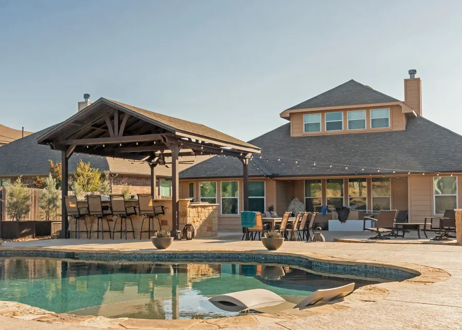 Del Norte Outdoor Kitchen Pavilion (Options: 20' L x 16' W, Mosaic Redwood, 4-Post Kit for Concrete, 1 Ceiling Fan Base, No Electrical Wiring Trim Kit, No Post Decorative Trims, Custom Sealant). Photo Courtesy of S. Oster of Round Rock, TX.