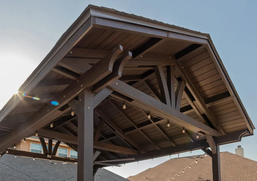 Del Norte Outdoor Kitchen Pavilion (Options: 20' L x 16' W, Mosaic Redwood, 4-Post Kit for Concrete, 1 Ceiling Fan Base, No Electrical Wiring Trim Kit, No Post Decorative Trims, Custom Sealant). Photo Courtesy of S. Oster of Round Rock, TX.