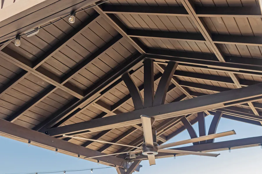Del Norte Outdoor Kitchen Pavilion (Options: 20' L x 16' W, Mosaic Redwood, 4-Post Kit for Concrete, 1 Ceiling Fan Base, No Electrical Wiring Trim Kit, No Post Decorative Trims, Custom Sealant). Photo Courtesy of S. Oster of Round Rock, TX.