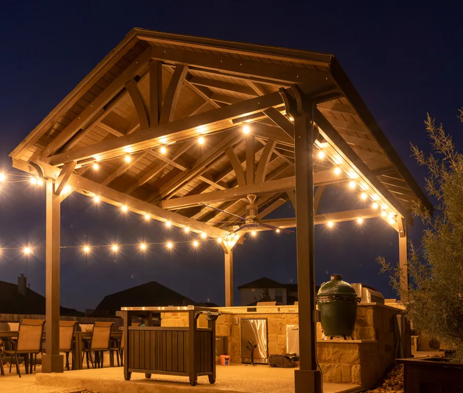 Del Norte Outdoor Kitchen Pavilion (Options: 20' L x 16' W, Mosaic Redwood, 4-Post Kit for Concrete, 1 Ceiling Fan Base, No Electrical Wiring Trim Kit, No Post Decorative Trims, Custom Sealant). Photo Courtesy of S. Oster of Round Rock, TX.