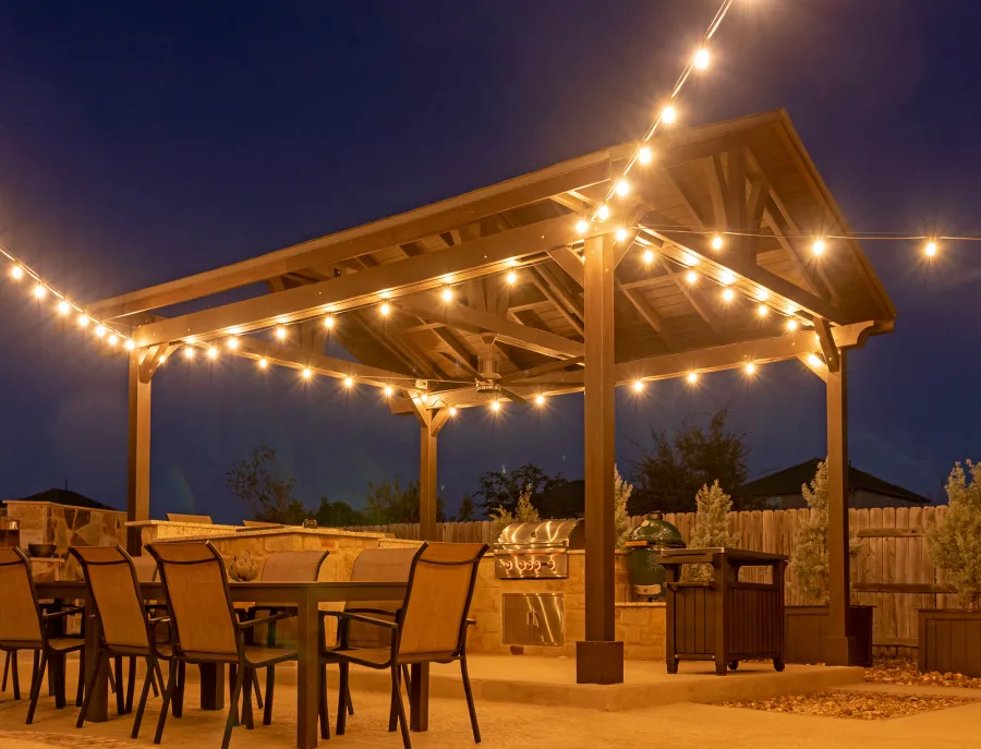 Del Norte Outdoor Kitchen Pavilion (Options: 20' L x 16' W, Mosaic Redwood, 4-Post Kit for Concrete, 1 Ceiling Fan Base, No Electrical Wiring Trim Kit, No Post Decorative Trims, Custom Sealant). Photo Courtesy of S. Oster of Round Rock, TX.
