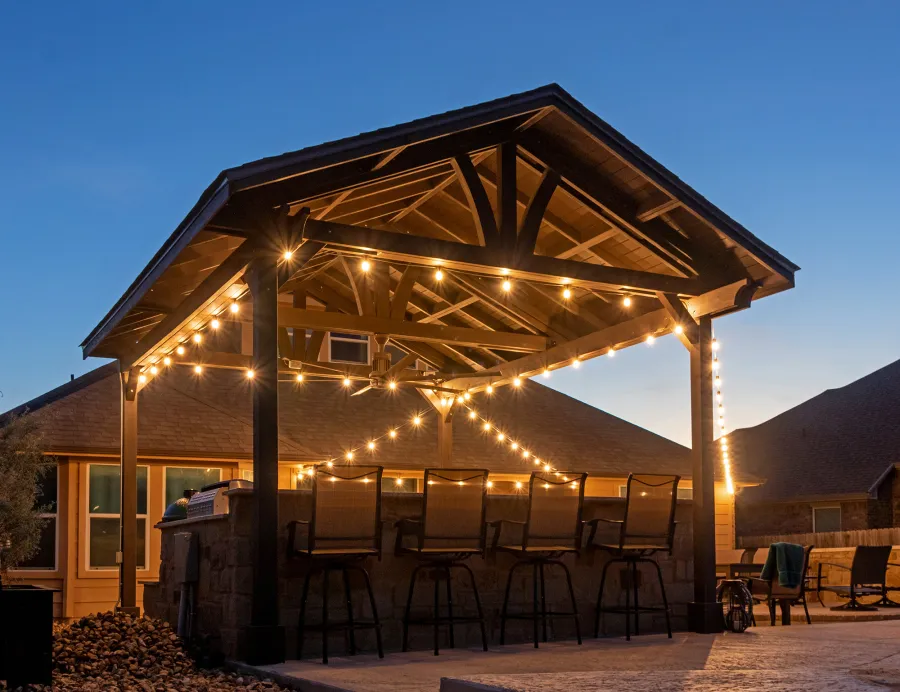 Del Norte Outdoor Kitchen Pavilion (Options: 20' L x 16' W, Mosaic Redwood, 4-Post Kit for Concrete, 1 Ceiling Fan Base, No Electrical Wiring Trim Kit, No Post Decorative Trims, Custom Sealant). Photo Courtesy of S. Oster of Round Rock, TX.