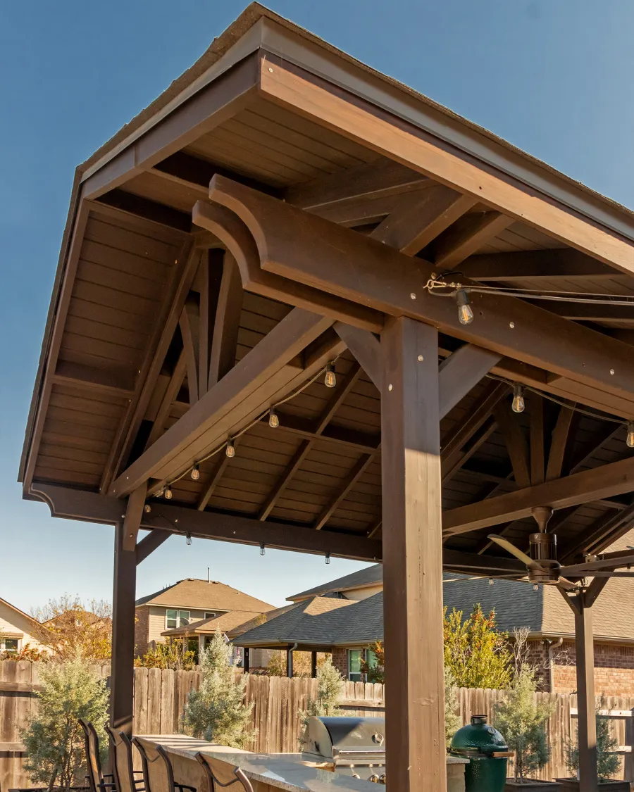 Del Norte Outdoor Kitchen Pavilion (Options: 20' L x 16' W, Mosaic Redwood, 4-Post Kit for Concrete, 1 Ceiling Fan Base, No Electrical Wiring Trim Kit, No Post Decorative Trims, Custom Sealant). Photo Courtesy of S. Oster of Round Rock, TX.