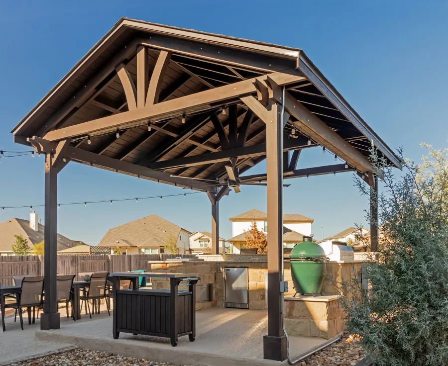 Del Norte Outdoor Kitchen Pavilion (Options: 20' L x 16' W, Mosaic Redwood, 4-Post Kit for Concrete, 1 Ceiling Fan Base, No Electrical Wiring Trim Kit, No Post Decorative Trims, Custom Sealant). Photo Courtesy of S. Oster of Round Rock, TX.
