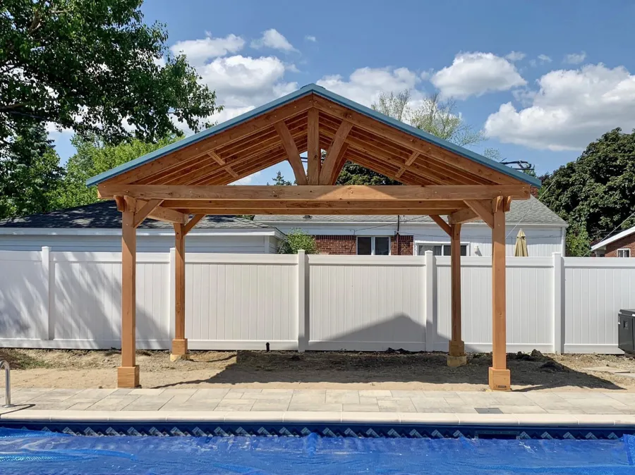 Del Norte Outdoor Kitchen Pavilion (Options: 12' L x 18' W, Douglas-fir, 4-Post Anchor Kit for High-Wind, With 2 Ceiling Fan Base, Electrical Wiring Trim Kit for 2 Posts, Transparent Premium Sealant). Metal Roof Installed by Customer. Photo courtesy of S. Bono of Royal Oak, Michigan.