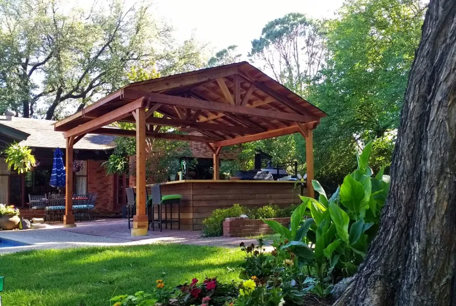 Del Norte Outdoor Kitchen Pavilion (Options: 18' L x 18' W, California Redwood, 4-Post Anchor Kit for Concrete, With a Ceiling Fan Base, Electrical Wiring Trim Kit for 2 Posts, Transparent Premium Sealant). Photo Courtesy of D. Blakelock of Dallas, TX.