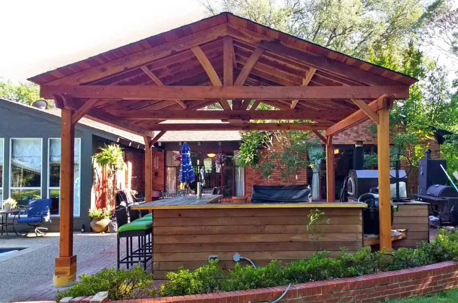 Del Norte Outdoor Kitchen Pavilion (Options: 18' L x 18' W, California Redwood, 4-Post Anchor Kit for Concrete, With a Ceiling Fan Base, Electrical Wiring Trim Kit for 2 Posts, Transparent Premium Sealant). Photo Courtesy of D. Blakelock of Dallas, TX.