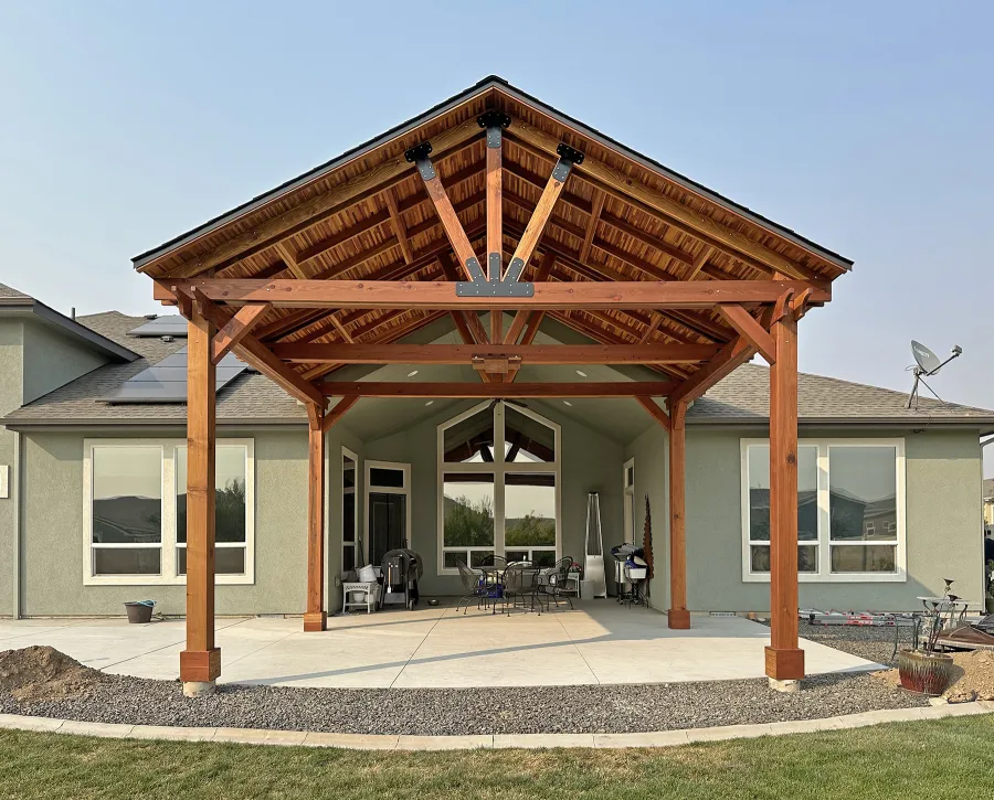 Custom Del Norte Outdoor Kitchen Pavilion (Options: 16' L x 20' W, California Redwood with Tongue and Grove Boards in Mosaic Redwood, No Privacy Panel, Post Anchor Kit for High Wind, 12' H Posts, 1 Ceiling Fan Base, No Electrical Wiring Trim, No Curtain Rod, Transparent Premium Sealant). Photo Courtesy of M. Neideffer of Star, ID.