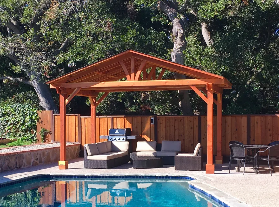 Del Norte Outdoor Kitchen Pavilion (Options: 11' L x 17' W, California Redwood, 4-Post Anchor Kit for Concrete, No Ceiling Fan Base, Transparent Premium Sealant). Roofing was still pending when shots taken just after assembly. Photo Courtesy of D. McCracken of Millbrae, CA.