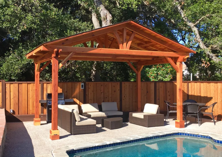 Del Norte Outdoor Kitchen Pavilion (Options: 11' L x 17' W, California Redwood, 4-Post Anchor Kit for Concrete, No Ceiling Fan Base, Transparent Premium Sealant). Roofing was still pending when shots taken just after assembly. Photo Courtesy of D. McCracken of Millbrae, CA.