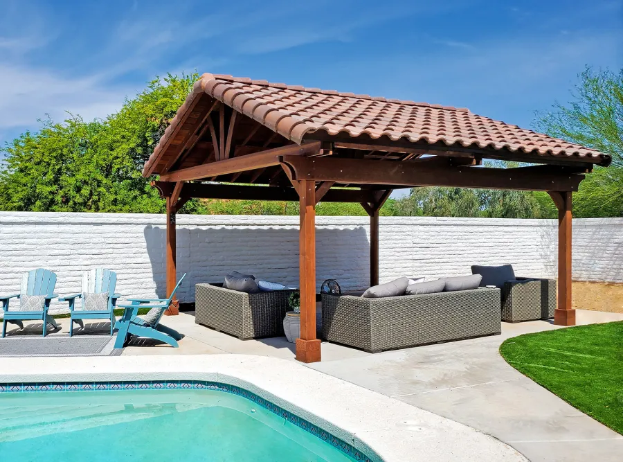 Del Norte Outdoor Kitchen Pavilion (Options: 18' L x 17' W, California Redwood, 4-Post Anchor Kit for Concrete, 9' H Posts, 1 Ceiling Fan Base, Coffee-Stain Premium Sealant, with 2x12's Supports and 2x8's Rafters). Photo Courtesy of K. Cashman of Scottsdale, Arizona.