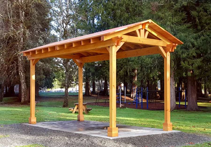 Custom Del Norte Outdoor Kitchen Pavilion (Options: 20' L x 10' W, Douglas-fir, 4-Post Anchor Kit for High-Wind, No Ceiling Fan Base, Transparent Premium Sealant). Larger lumber by custom request. Roofing was still pending when shots taken just after assembly. Photo Courtesy of S. Flanagin of Carnation, WA.