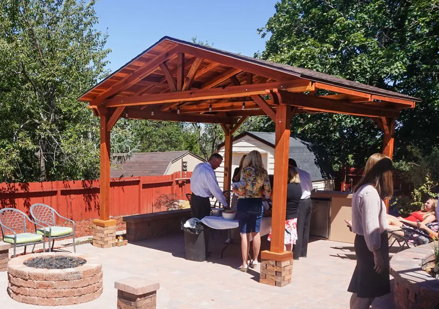 Del Norte Outdoor Kitchen Pavilion (Options: 16' L x 14' W, California Redwood [Mature Redwood Posts], Unattached, 4-Post Anchor Kit for High-Wind, Electrical Wiring Trim for 1 Post, 9.5' Posts, No Ceiling Fan Base, No Privacy Panels, No Curtain Rods, Transparent Premium Sealant). Shingles not Included. Photo Courtesy of K. Hyde of Ogden, Utah.