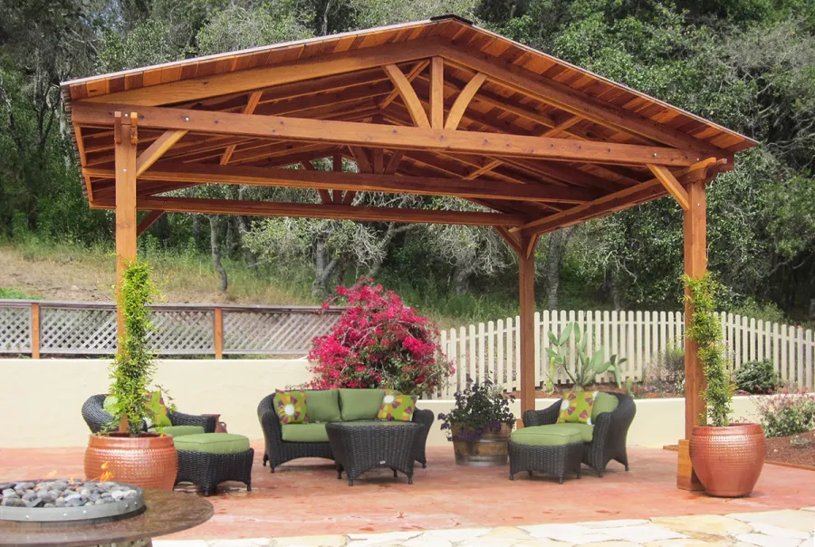 Del Norte Outdoor Kitchen Pavilion (Options: 14' L x 18' W, California Redwood, Unattached, 4-Post Anchor Kit for High-Wind, No Electrical Wiring Trim, 9.5' Posts, No Ceiling Fan Base, No Privacy Panels, No Curtain Rods, Transparent Premium Sealant). Photo Courtesy of Frank Giuliani of Watsonville, CA.