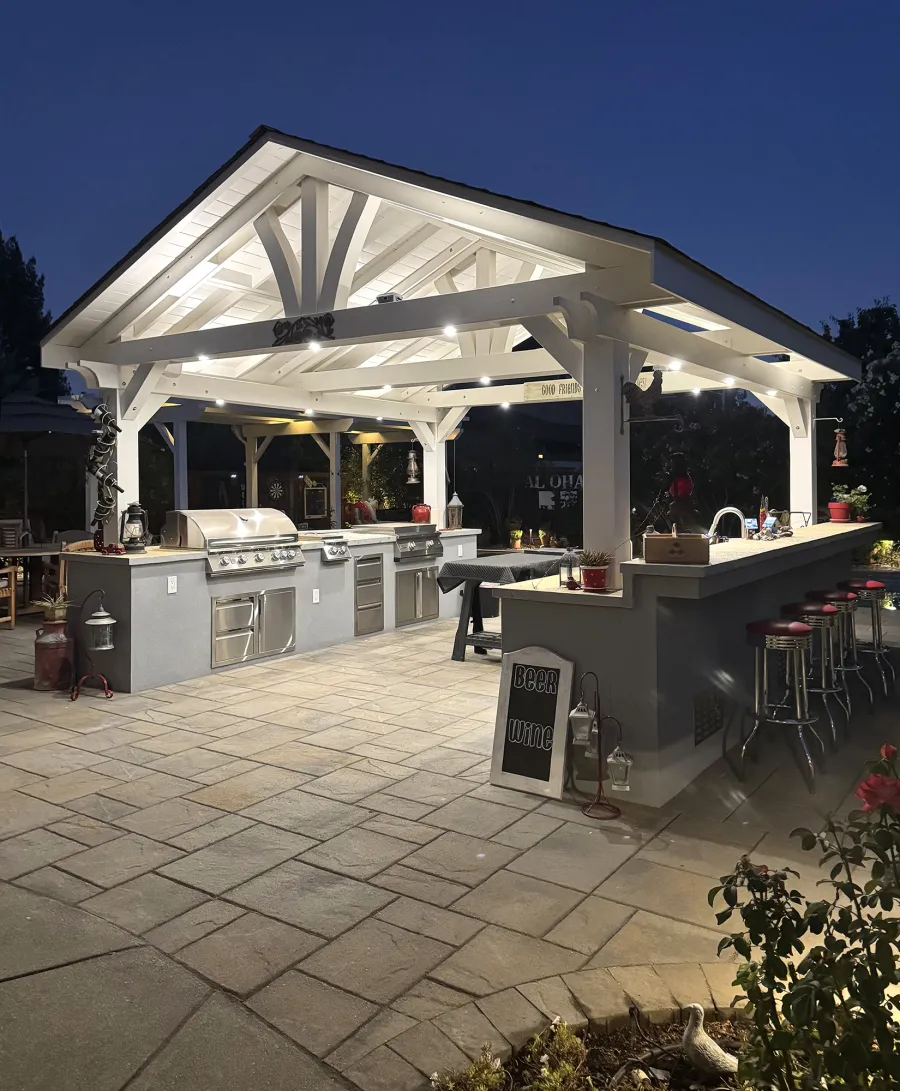 Del Norte Outdoor Kitchen Pavilion (Options: 16' L x 16' W, Douglas-fir, 4-Post Anchor Kit for High-Wind, 2 Fascia Boards, No Ceiling Fan Base, No Electrical Wiring Trim Kit, No Post Decorative Trims, Off-White Oil-Based Primer). Photo Courtesy of J. Felice of Cloverdale, CA.