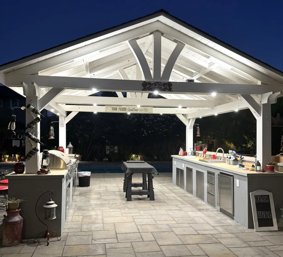 Del Norte Outdoor Kitchen Pavilion (Options: 16' L x 16' W, Douglas-fir, 4-Post Anchor Kit for High-Wind, 2 Fascia Boards, No Ceiling Fan Base, No Electrical Wiring Trim Kit, No Post Decorative Trims, Off-White Oil-Based Primer). Photo Courtesy of J. Felice of Cloverdale, CA.
