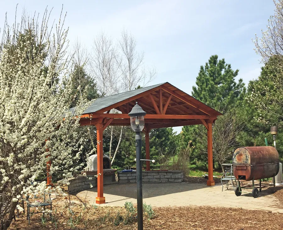 Del Norte Outdoor Kitchen Pavilion (Options: 16' L x 20' W, California Redwood, 4-Post Kit for High-Wind, No Ceiling Fan Base, Transparent Premium Sealant). Photo Courtesy of Mary Ann Kennefick of Barrington Hills, IL.