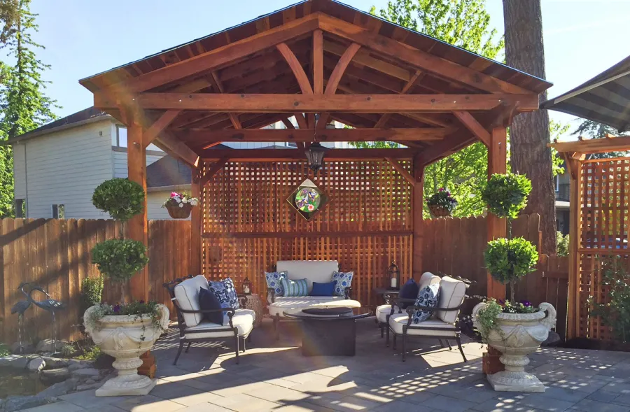 Del Norte Outdoor Kitchen Pavilion (Options: 14' L x 14' W, California Redwood, Unattached, 4-Post Anchor Kit for Concrete, Electrical Wiring Trim for 1 Post, 9' Posts, No Ceiling Fan Base, 2 Custom Privacy Panels, No Curtain Rods, Transparent Premium Sealant). Photo Courtesy of Michael Walti of Hillsboro, Oregon.