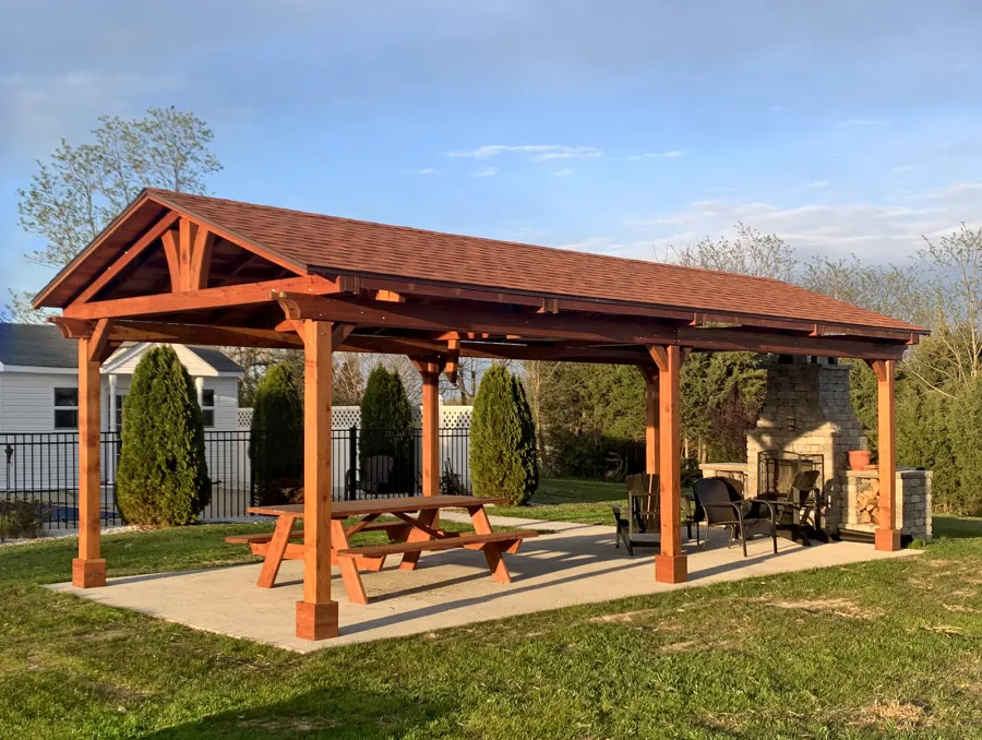 Del Norte Outdoor Kitchen Pavilion (Options: 30' L x 14' W, California Redwood, 6-Post Anchor Kit for Concrete, 1 Ceiling Fan Base, 2 Electrical Wiring Trim Kits, No Post Decorative Trims, Transparent Premium Sealant). Photo Also Shows a Forever Picnic Table. Photo Courtesy of M. Luebke of Front Royal, Virginia.