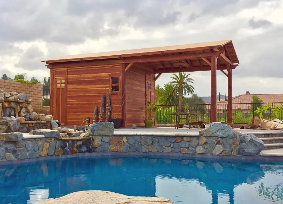 Custom Del Norte Outdoor Kitchen Pavilion with enclosed bathroom and front "porch area" (Options: 28' L x 14' W, California Redwood, 6-Post Anchor Kit for High-Wind, No Ceiling Fan Base, Electrical Wiring Trim Kit for 1 Post, Transparent Premium Sealant). Photo Courtesy of C. Nelson of Riverside, CA. Final roofing skin (composite shingles) was added a few days after these pictures were taken.
