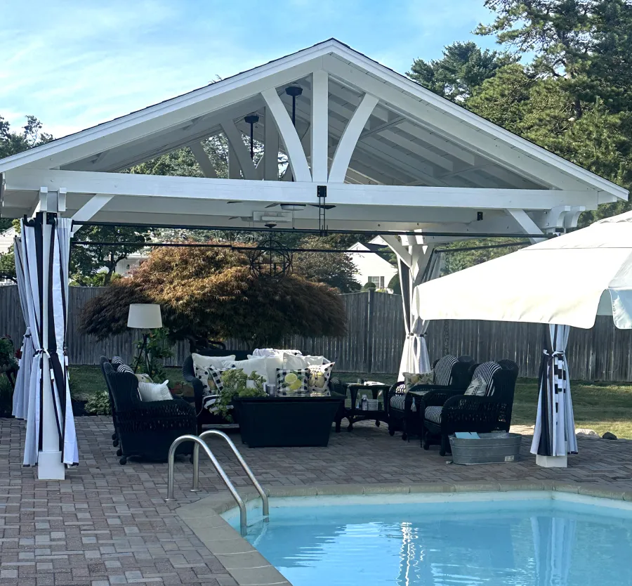 Del Norte Outdoor Kitchen Pavilion (Options: 15' L x 18' W, Mosaic Douglas-Fir, 4-Post Anchor Kit for Concrete, 9.5' H Posts, 1 Ceiling Fan Base, 1 Electrical Wiring Trim Kit, 4 Curtain Rods, White Stain Premium Sealant). Photo Courtesy of S. Leonard of Easton, MA.