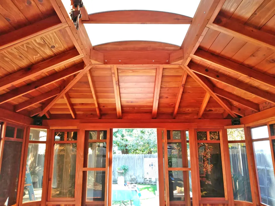 DIY Wood Gazebo (14' L, 12' W, California Redwood, All Sliding Windows with Screens, 4' x 6' Skylight, 36" H Siding Below Windows, Vertical Siding, Japanese Doors with Screens, No Flooring, Transparent Premium Sealant). Photo Courtesy of B. Adkisson of Sacramento, CA. XL Custom Roof per Customer Request.
