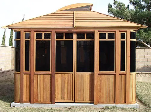 DIY Wood Gazebo (14' L, 12' W, Mature Redwood, Sliding Windows, 4' x 6' Skylight, 24" H Siding Below Windows, Vertical Siding, Japanese Doors, No Flooring, Transparent Premium Sealant). Custom detail: Roof overhang was minimized per customer request.