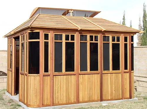DIY Wood Gazebo (14' L, 12' W, Mature Redwood, Sliding Windows, 4' x 6' Skylight, 24" H Siding Below Windows, Vertical Siding, Japanese Doors, No Flooring, Transparent Premium Sealant). Custom detail: Roof overhang was minimized per customer request.